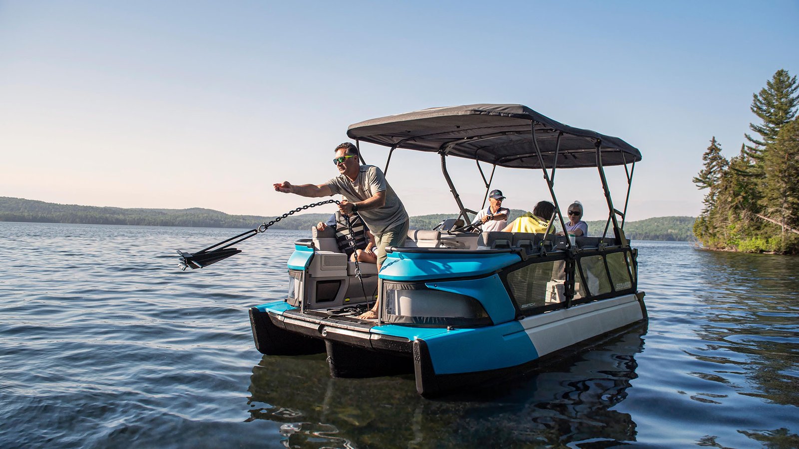 Group of friends on a Sea-Doo Switch pontoon on a Manitoba lake